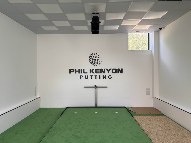 An image of the indoor putting area with channel letters.